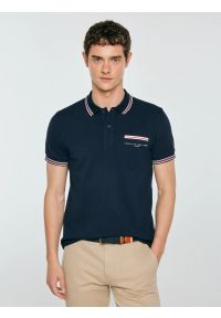 Big-Star - Koszulka męska polo z kontrastowym wykoŅczeniem granatowa Polos 403. Okazja: na co dzień, na spotkanie biznesowe. Typ kołnierza: polo. Kolor: niebieski. Materiał: dzianina. Wzór: nadruk, ze splotem. Styl: casual, biznesowy, elegancki #1