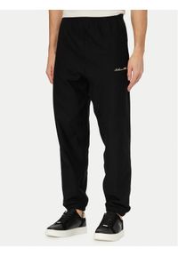 Calvin Klein Jeans Spodnie dresowe LV04RF249G Czarny Regular Fit. Kolor: czarny. Materiał: bawełna #1