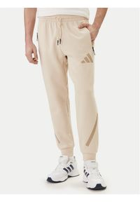 Adidas - adidas Spodnie dresowe Z.N.E. KE4684 Beżowy Regular Fit. Kolor: beżowy. Materiał: bawełna #1