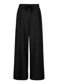 Volcano - Czarne, luźne spodnie dresowe N-MOCK. Kolor: czarny. Materiał: dresówka. Wzór: gładki #1