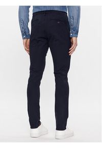 Guess Spodnie materiałowe M4RB29 WFYTA Granatowy Slim Fit. Kolor: niebieski. Materiał: bawełna