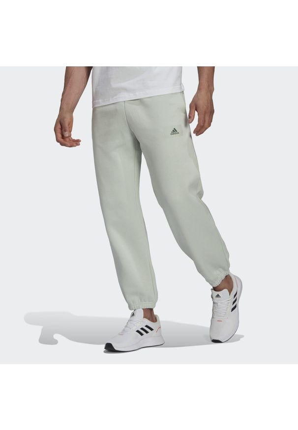 Adidas - Bawełniany kombinezon do joggingu adidas Essentials Colorblock. Kolor: zielony. Materiał: bawełna. Sport: bieganie