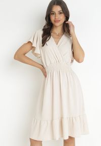 Born2be - Jasnobeżowa Sukienka Mini z Gumką w Pasie i Falbanką Senait. Kolor: beżowy. Długość: mini #1