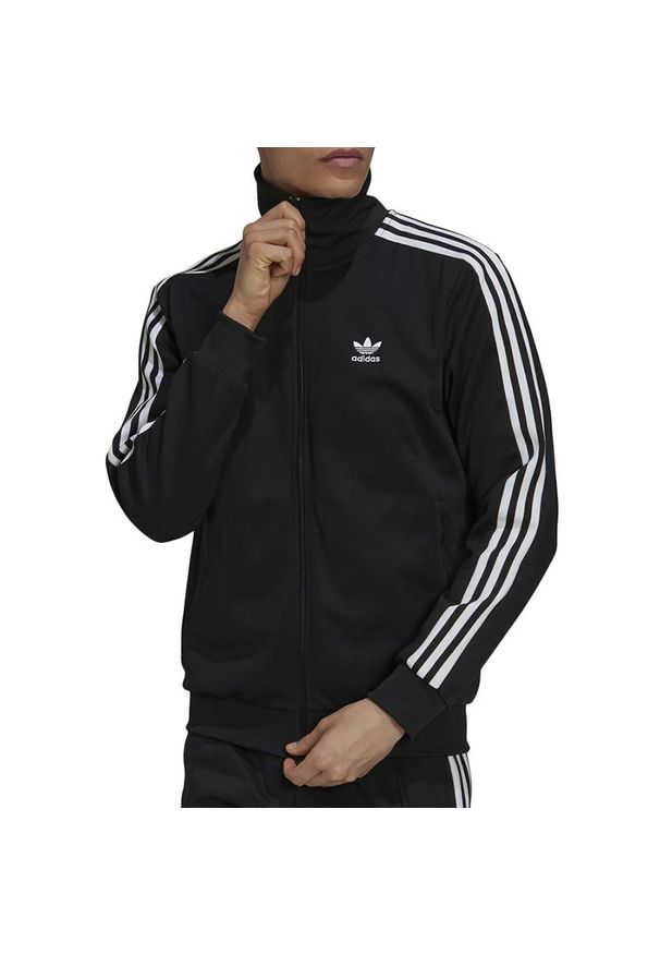 Adidas - Bluza adidas Originals Adicolor Classics Beckenbauer Primeblue Track Top H09112 - czarna. Kolor: czarny. Materiał: bawełna, tkanina, poliester, dresówka. Wzór: gładki, paski. Sezon: lato. Styl: klasyczny. Sport: piłka nożna