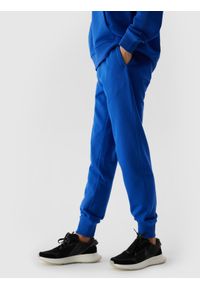 4f - Spodnie dresowe joggery damskie - kobaltowe. Kolor: niebieski. Materiał: dresówka. Wzór: gładki, ze splotem