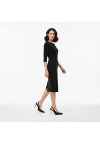 CheBello - Czółenka damskie Chebello, cholewka ze skóry naturalnej z odkrytą piętą i smukłym noskiem ozdobione metaliczną klamrą osadzone na cienkim obcasie pod. Zapięcie: klamry. Kolor: czarny. Materiał: skóra. Szerokość cholewki: normalna. Wzór: aplikacja. Obcas: na obcasie. Styl: elegancki, klasyczny. Wysokość obcasa: średni #2