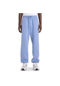 Spodnie męskie New Balance Reimagined Fleece Jogger MB61E74AAA3 - niebieskie. Kolor: niebieski. Materiał: materiał, dresówka, poliester, bawełna #1