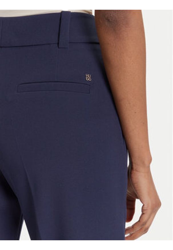Hugo - HUGO Spodnie materiałowe Hedima-1 50544742 Granatowy Slim Fit. Kolor: niebieski. Materiał: syntetyk