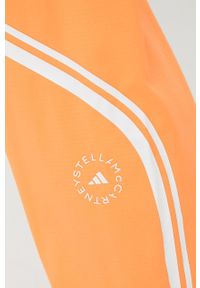 Adidas by Stella McCartney - adidas by Stella McCartney spodnie treningowe Truepace HC2985 damskie kolor pomarańczowy z nadrukiem. Kolor: pomarańczowy. Materiał: materiał. Wzór: nadruk #3