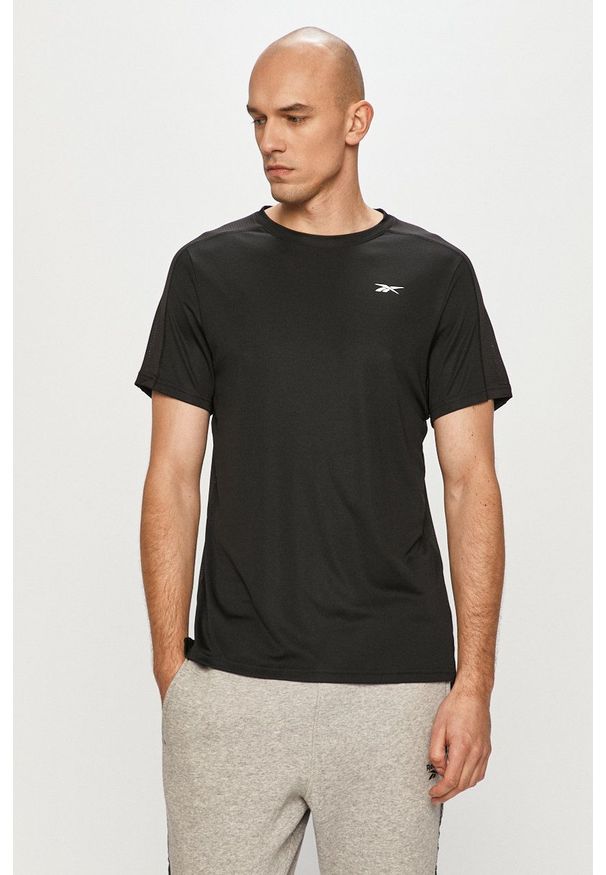 Reebok - T-shirt. Okazja: na co dzień. Kolor: czarny. Materiał: dzianina, skóra. Wzór: gładki. Styl: casual