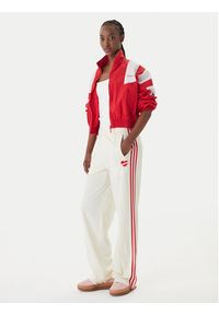 Adidas - adidas Spodnie dresowe Firebird KQ8056 Beżowy Loose Fit. Kolor: beżowy. Materiał: syntetyk #5