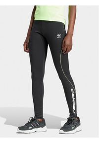 Adidas - adidas Legginsy Graphic IT9700 Czarny Slim Fit. Kolor: czarny. Materiał: syntetyk