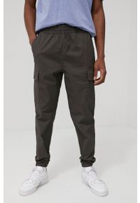 New Balance spodnie MP13501COG męskie kolor zielony gładkie. Kolor: zielony. Materiał: bawełna. Wzór: gładki #2