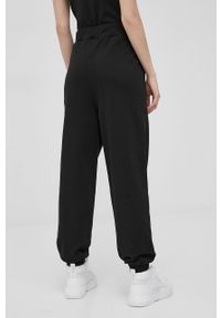 Tommy Jeans spodnie bawełniane damskie kolor czarny gładkie. Stan: podwyższony. Kolor: czarny. Materiał: bawełna. Wzór: gładki
