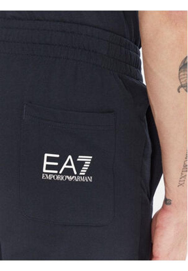 EA7 Emporio Armani Spodnie dresowe 7M000571 AF13512 MB149 Granatowy Regular Fit. Kolor: niebieski. Materiał: bawełna