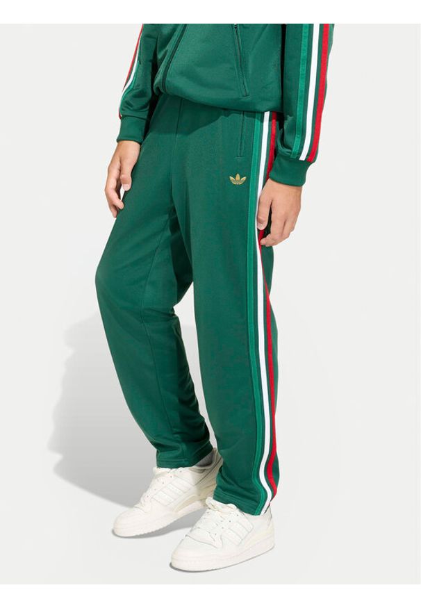 Adidas - adidas Spodnie dresowe Firebird KC9502 Zielony Regular Fit. Kolor: zielony. Materiał: syntetyk