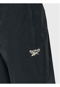 Reebok Spodnie dresowe Vector HK7077 Czarny Slim Fit. Kolor: czarny. Materiał: syntetyk