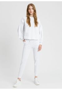 TwinSet - Białe spodnie dresowe Twinset. Kolor: biały. Materiał: dresówka. Wzór: napisy #1