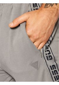Guess Spodnie dresowe U1GA11 K6ZS1 Szary Regular Fit. Kolor: szary. Materiał: dresówka #2
