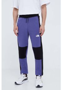 The North Face spodnie dresowe bawełniane kolor fioletowy wzorzyste. Kolor: fioletowy. Materiał: bawełna, dresówka #1