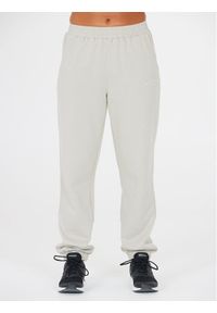 Athlecia Spodnie dresowe Asport W Pants EA233347 Beżowy Regular Fit. Kolor: beżowy. Materiał: bawełna