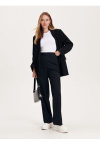 Reserved - Spodnie z kantem - granatowy. Kolor: niebieski. Materiał: wiskoza, tkanina #1