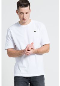 Lacoste T-shirt TH7618 kolor biały gładki TH7618-001. Okazja: na co dzień. Kolor: biały. Materiał: dzianina. Wzór: gładki. Styl: casual