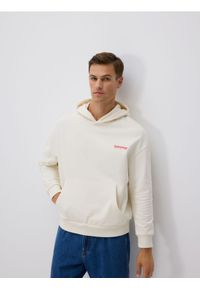 Reserved - Bawełniana bluza z kapturem SUPERMAN™ - złamana biel. Typ kołnierza: kaptur. Materiał: bawełna. Wzór: motyw z bajki #1