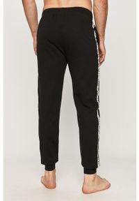 DKNY - Dkny - Spodnie piżamowe. Kolor: czarny. Materiał: bawełna, dzianina. Wzór: aplikacja #3