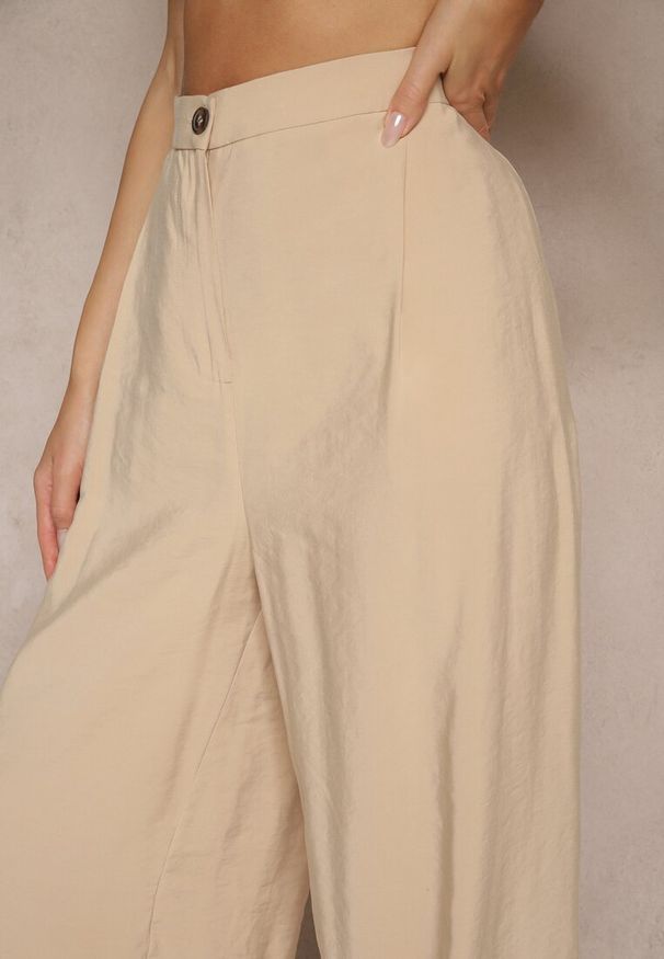 Renee - Beżowe Spodnie Low Waist z Modalu z Szeroką Nogawką Reanelira. Okazja: na co dzień. Stan: obniżony. Kolor: beżowy. Styl: elegancki, klasyczny, casual