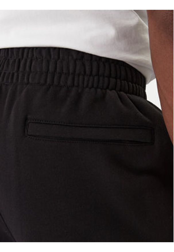 Calvin Klein Jeans Spodnie dresowe GSM LV04RD252G Czarny Regular Fit. Kolor: czarny. Materiał: bawełna