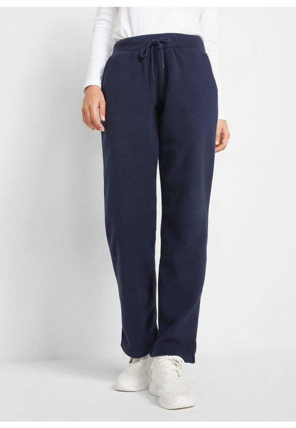 bonprix - Polarowe spodnie z elastyczną gumką w talii. Okazja: na co dzień. Kolor: niebieski. Materiał: polar. Styl: casual