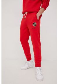 Superdry spodnie dresowe męskie kolor czerwony z aplikacją. Kolor: czerwony. Materiał: dresówka. Wzór: aplikacja