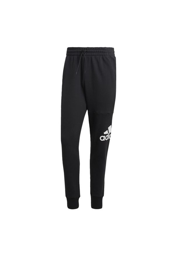 Adidas - Spodnie dresowe adidas Essentials French Terry Tapered Cuff. Kolor: czarny. Materiał: dresówka. Sport: fitness