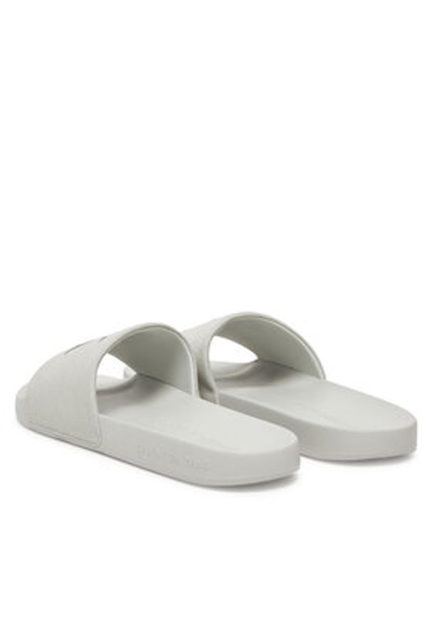 Calvin Klein Jeans Klapki Slide Monogram Cv YM0YM01271 Szary. Kolor: szary. Materiał: materiał