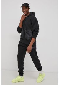 adidas Originals Spodnie męskie kolor czarny z nadrukiem. Kolor: czarny. Materiał: poliester, dzianina, bawełna. Wzór: nadruk