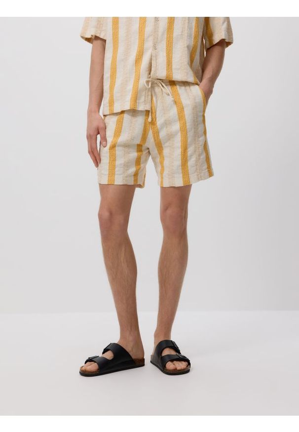 Reserved - Bawełniane szorty jogger - bursztynowy. Kolor: pomarańczowy. Materiał: bawełna