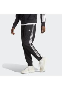 Adidas - AEROREADY Essentials Tapered Cuff Woven 3-Stripes Pants. Kolor: czarny, wielokolorowy, biały. Materiał: materiał, dresówka