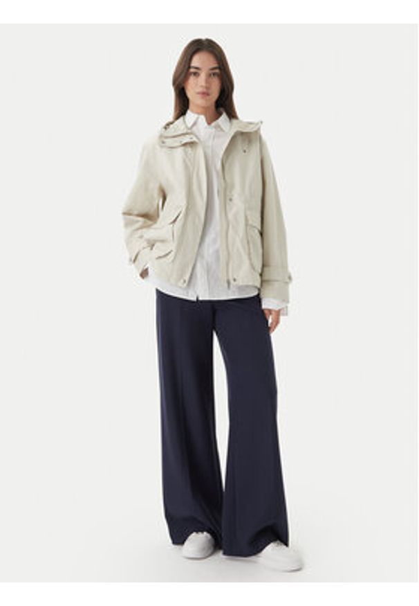 TOMMY HILFIGER - Tommy Hilfiger Kurtka przejściowa Utility WW0WW48612 Beżowy jasny Relaxed Fit. Kolor: beżowy. Materiał: syntetyk