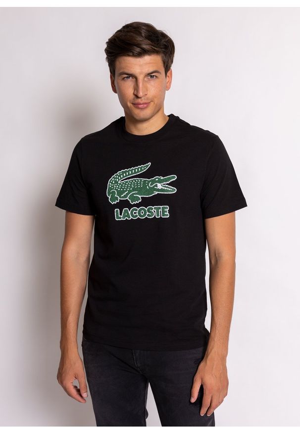 Koszulka męska Lacoste (TH0063-031). Typ kołnierza: polo. Kolor: czarny. Materiał: dzianina. Długość: krótkie. Sezon: lato. Sport: bieganie