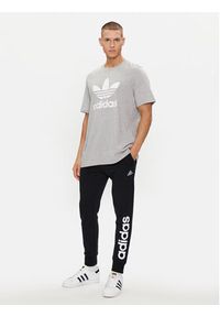 Adidas - adidas Spodnie dresowe Essentials French Terry Tapered Cuff Logo Joggers IC0063 Czarny Regular Fit. Kolor: czarny. Materiał: bawełna #4