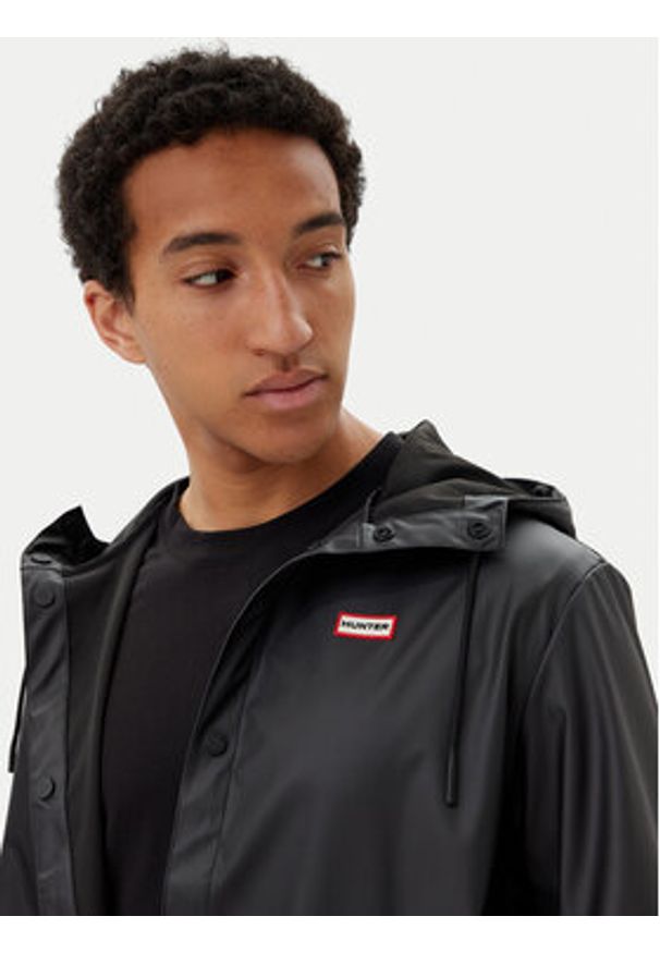 Hunter Kurtka przeciwdeszczowa Izzy Unisex HARU0012251 Czarny Regular Fit. Kolor: czarny. Materiał: syntetyk