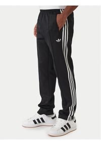 Adidas - adidas Spodnie dresowe Classic KE3530 Czarny Slim Fit. Kolor: czarny. Materiał: syntetyk #1