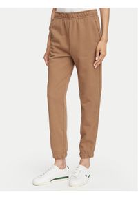 Lacoste Spodnie dresowe XF5268 Beżowy Regular Fit. Kolor: beżowy. Materiał: bawełna #1