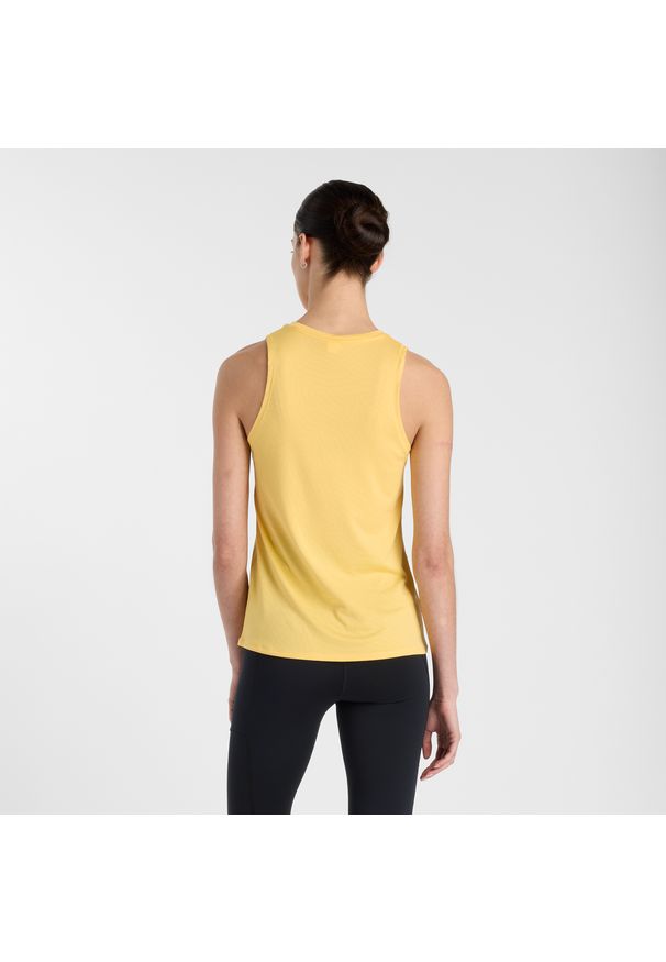 Koszulka damska New Balance WT51252CEE – żółta. Kolor: żółty. Materiał: materiał, tkanina, poliester