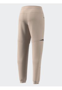 Adidas - adidas Spodnie dresowe Terrex Utilitas Hiking Zip-Off Tracksuit Bottoms HZ9046 Beżowy Regular Fit. Kolor: beżowy. Materiał: syntetyk #8