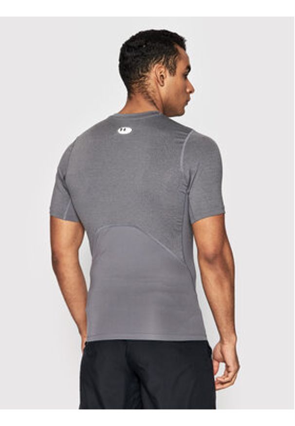 Under Armour Koszulka techniczna HeatGear® 1361518 Szary Slim Fit. Kolor: szary. Materiał: syntetyk