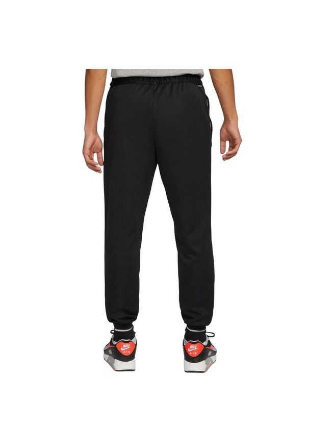 Nike - Męskie Spodnie Do Biegania Tribuna Sock Jogging Bottoms. Kolor: czarny. Sport: bieganie