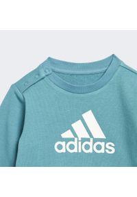 Adidas - Badge of Sport French Terry Jogger. Kolor: biały, wielokolorowy, niebieski. Materiał: dresówka. Styl: sportowy