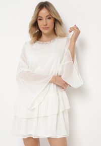 Born2be - Jasnobeżowa Rozkloszowana Sukienka Mini z Dekoltem Ozdobionym Cyrkoniami i Falbanką Stevianta. Kolor: beżowy. Wzór: aplikacja. Długość: mini #6